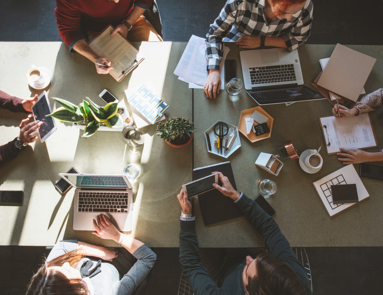 People sitting at meeting table from above
